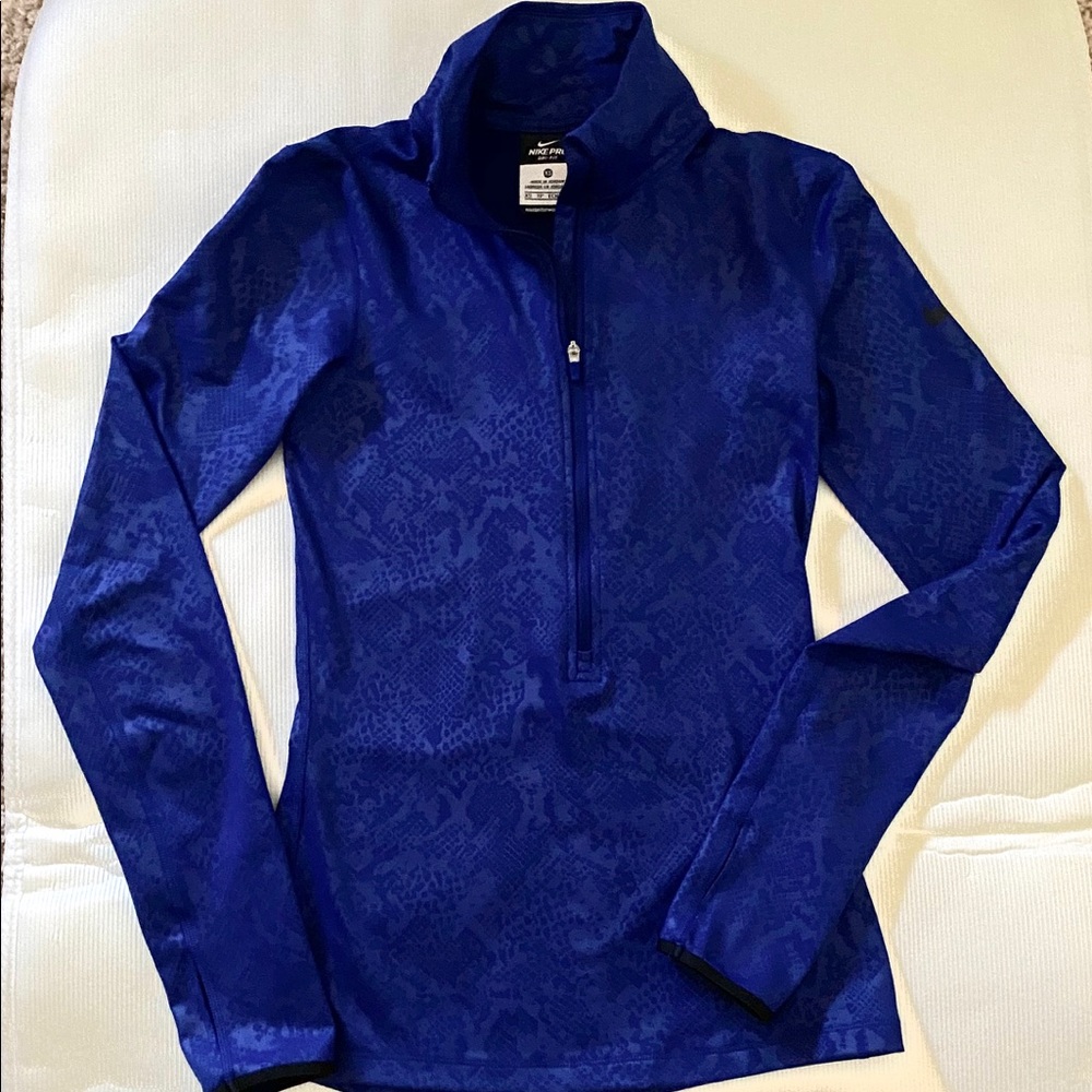 Nike Women’s Long Sleeve Dri-Fit Pullover Top.
